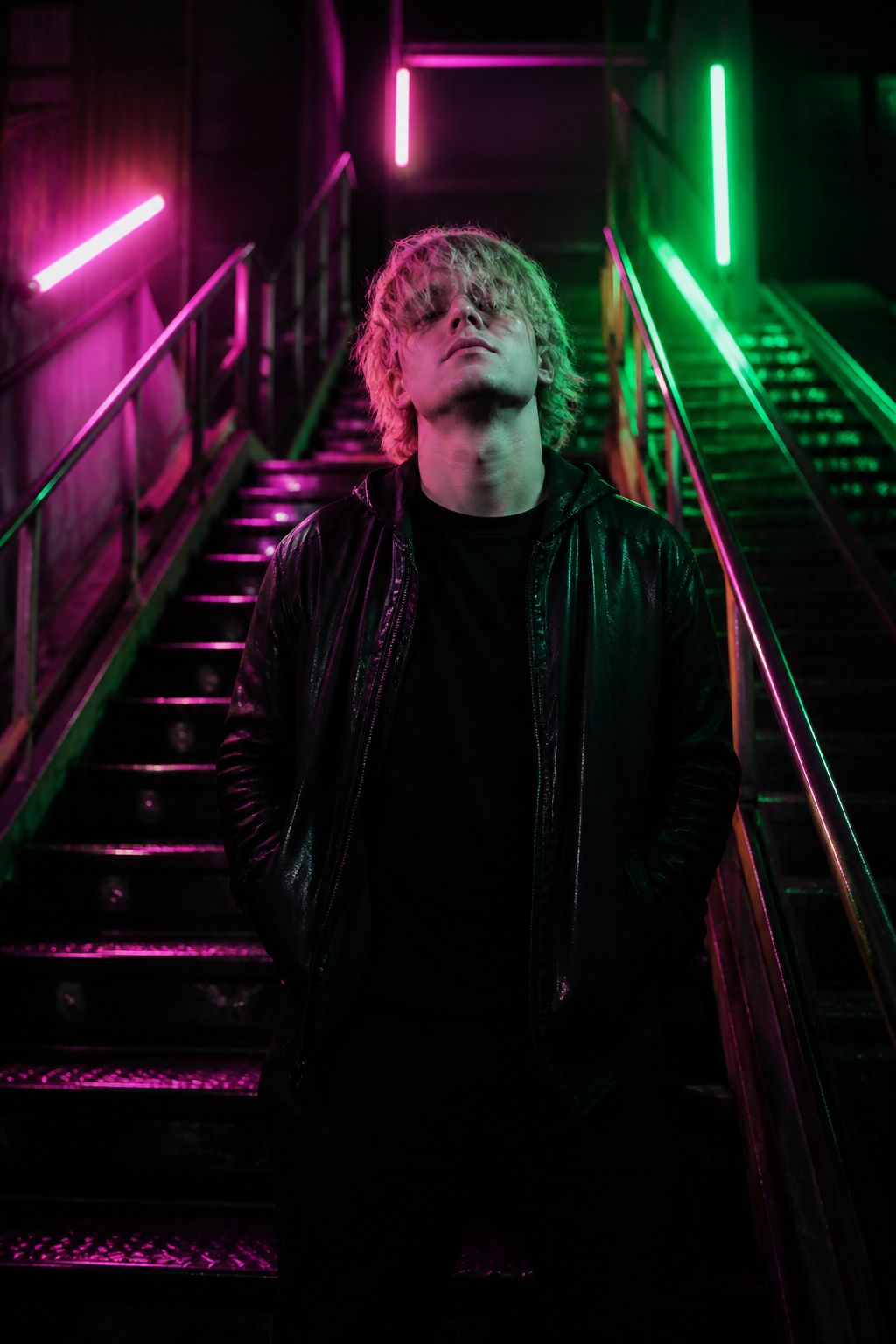 Vertical 9:16 music video frame of a singer in neon rain for a Kling O3 prompt